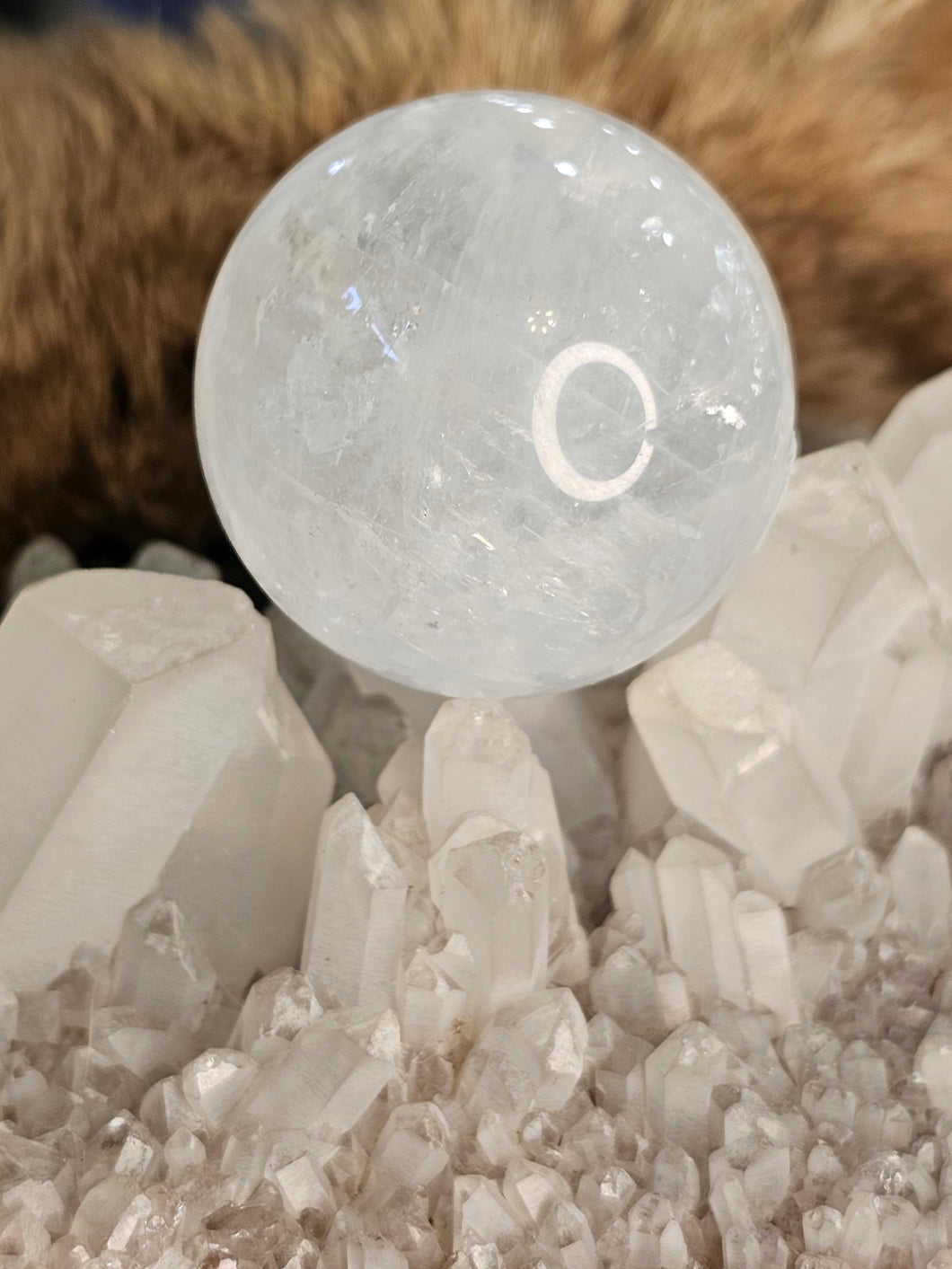 White calcite sphere with rainbows 🌈