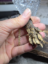 Load image into Gallery viewer, Raccoon paw 30 inch gold tone necklace

