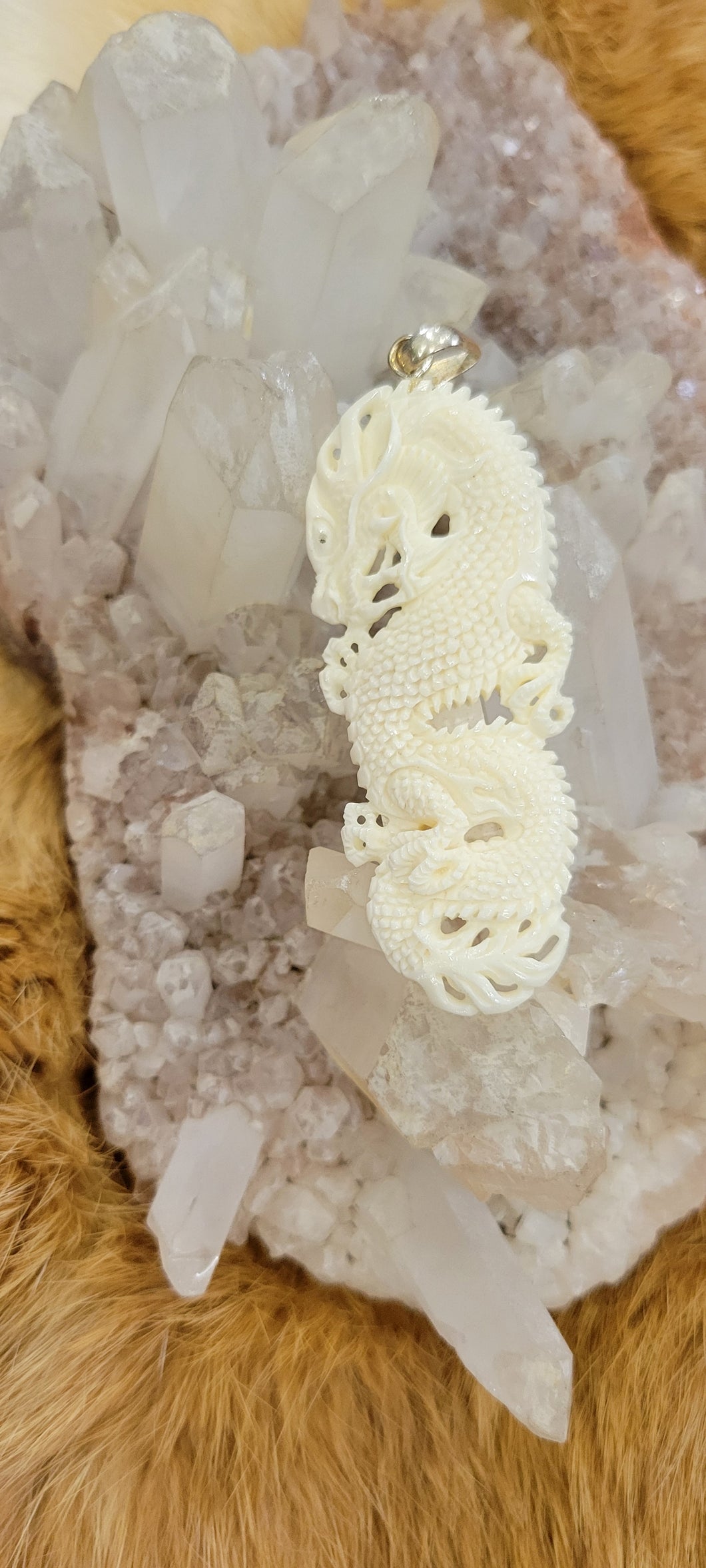 Bone carved dragon pendant