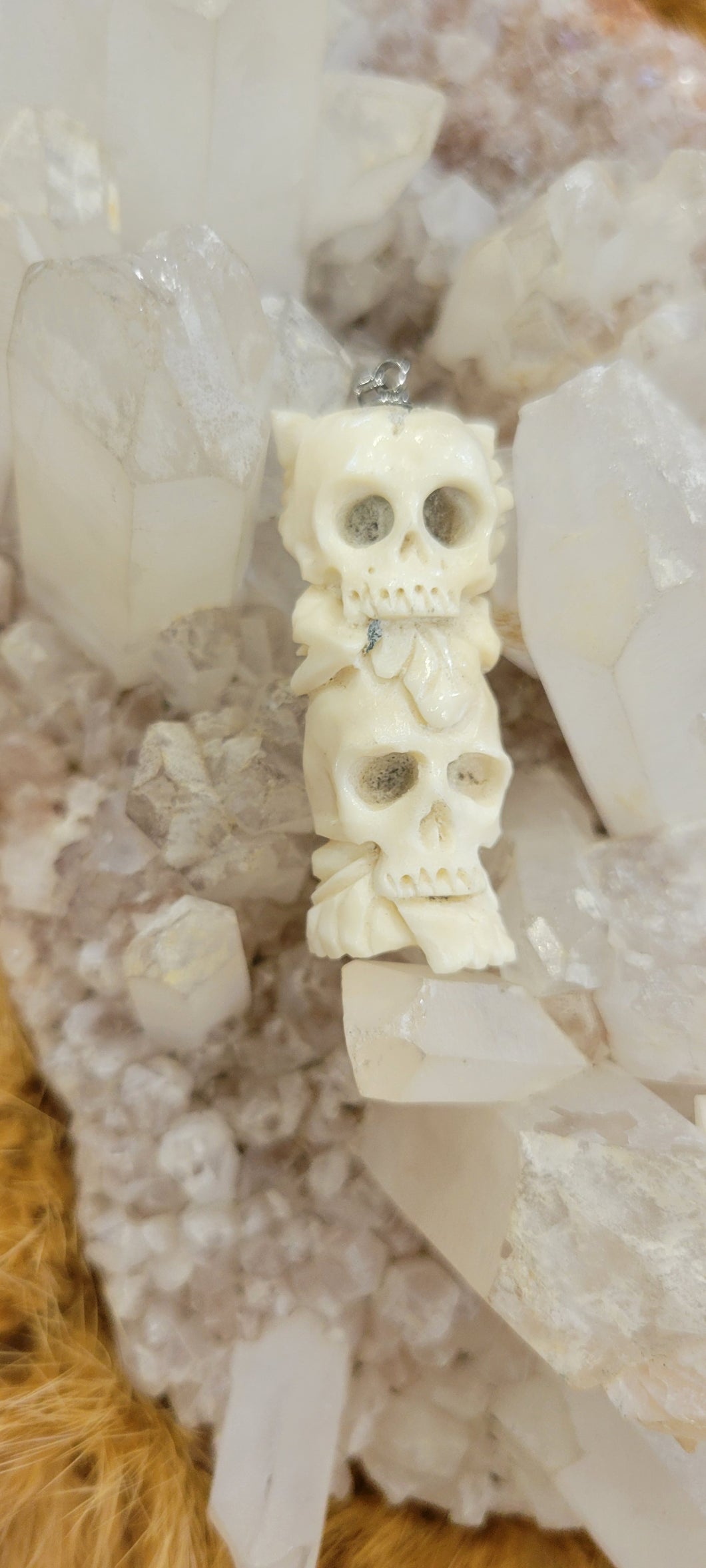 Double skull bone carved pendant