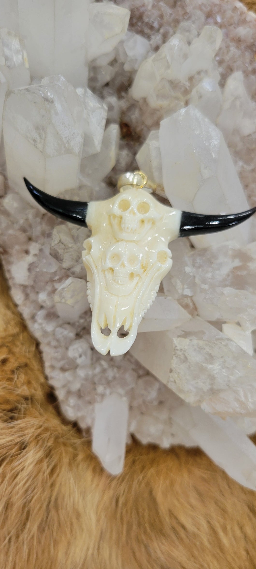 Bone carved cow skull pendant